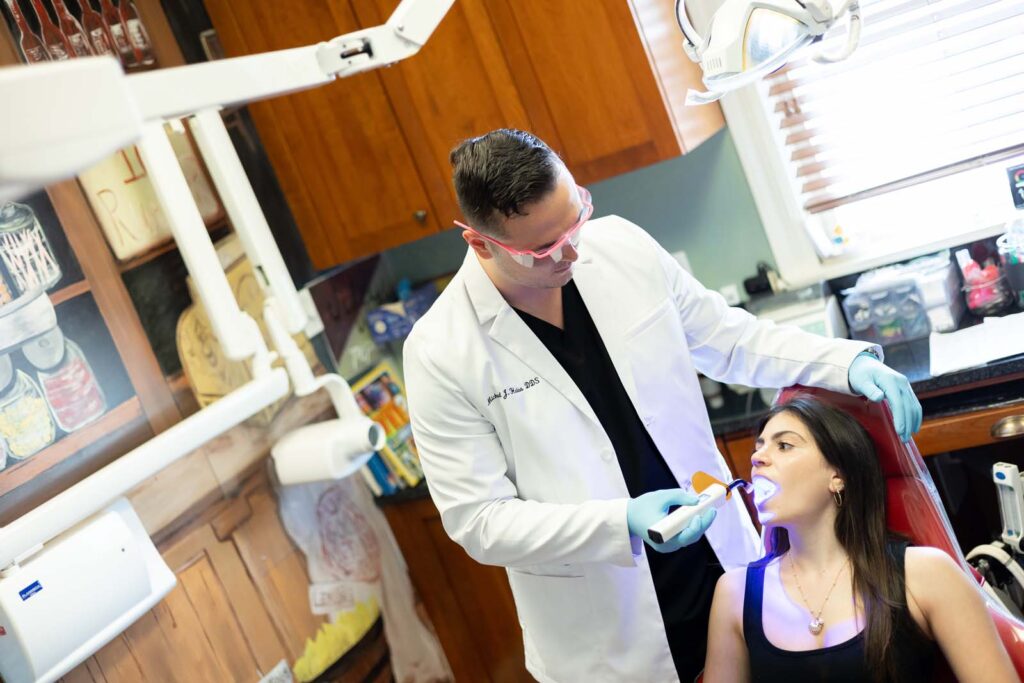 Dr. Heiss using a soft tissue laser on a patient